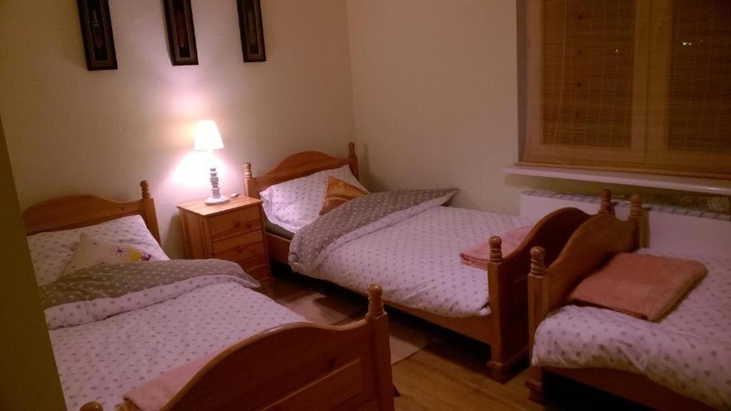 Кровать или кровати в номере Apartament Familijny