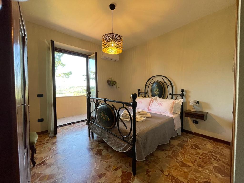 Postel nebo postele na pokoji v ubytování Agriturismo con cucina Il Favaio