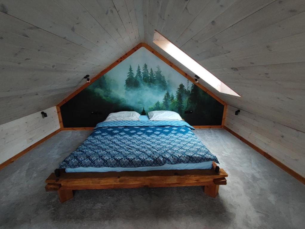 Posteľ alebo postele v izbe v ubytovaní Domki nad Jeziorem Sunia