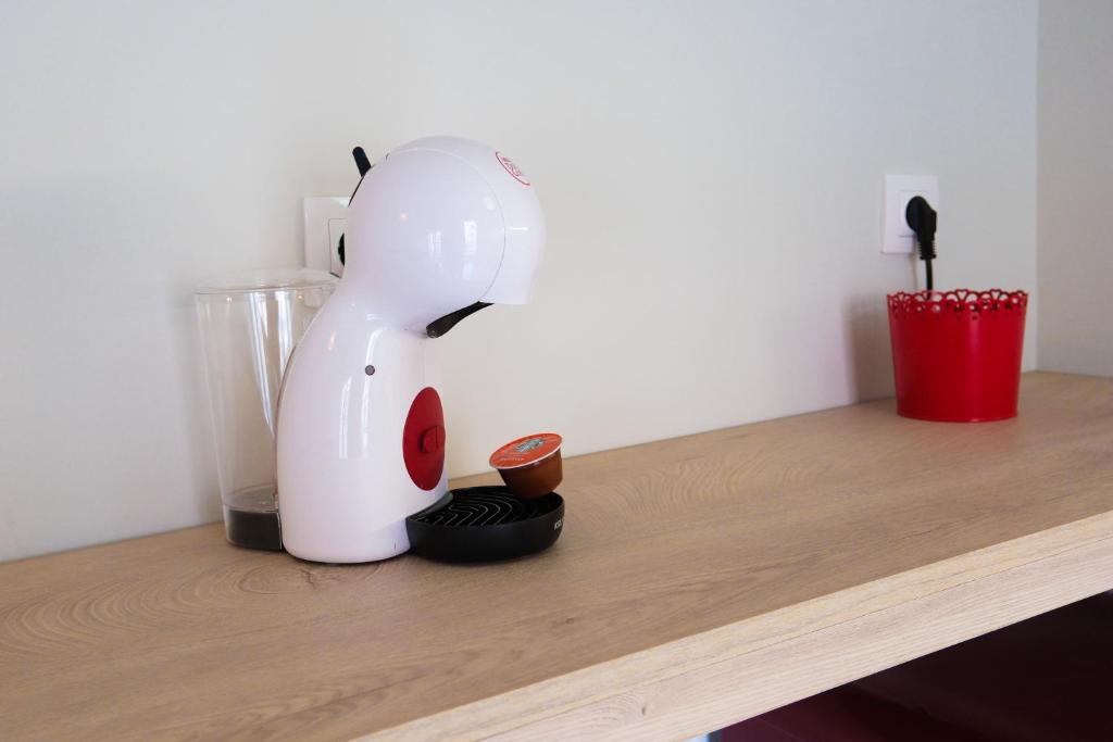 a white blender sitting on top of a counter at NGsuite cityspot Volos in Volos