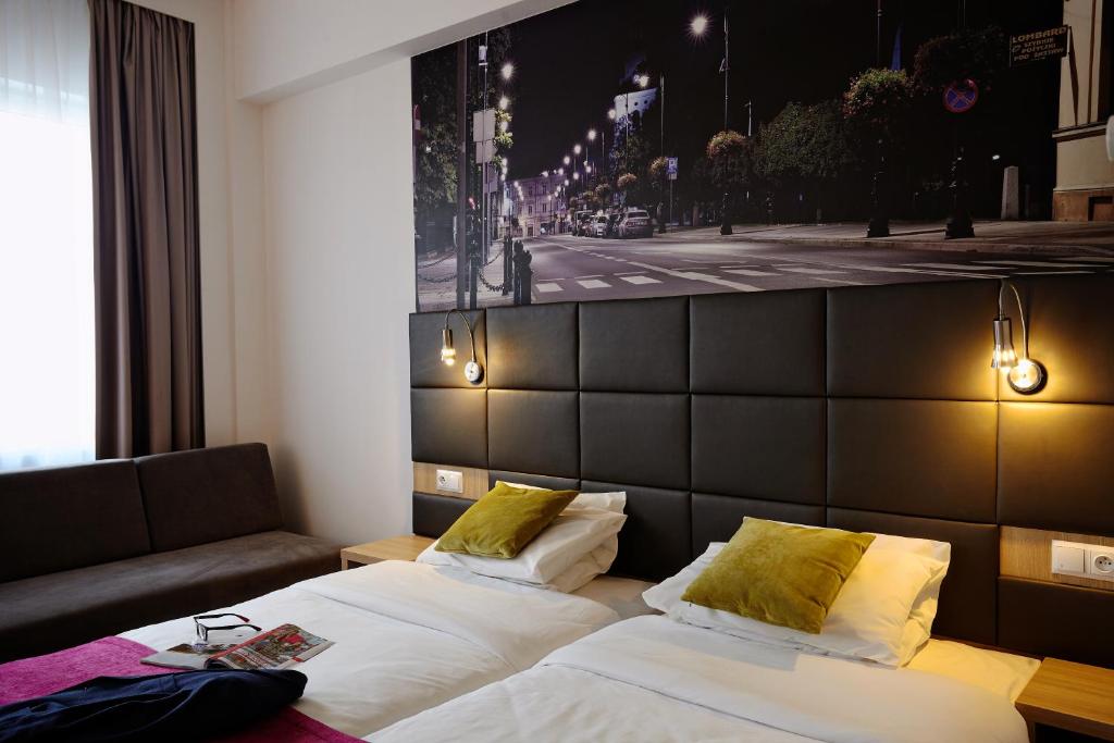 Posteľ alebo postele v izbe v ubytovaní Vestil Hotel