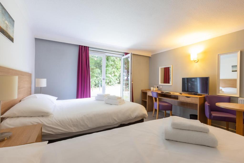 The Broadway Park Hotelにあるベッド