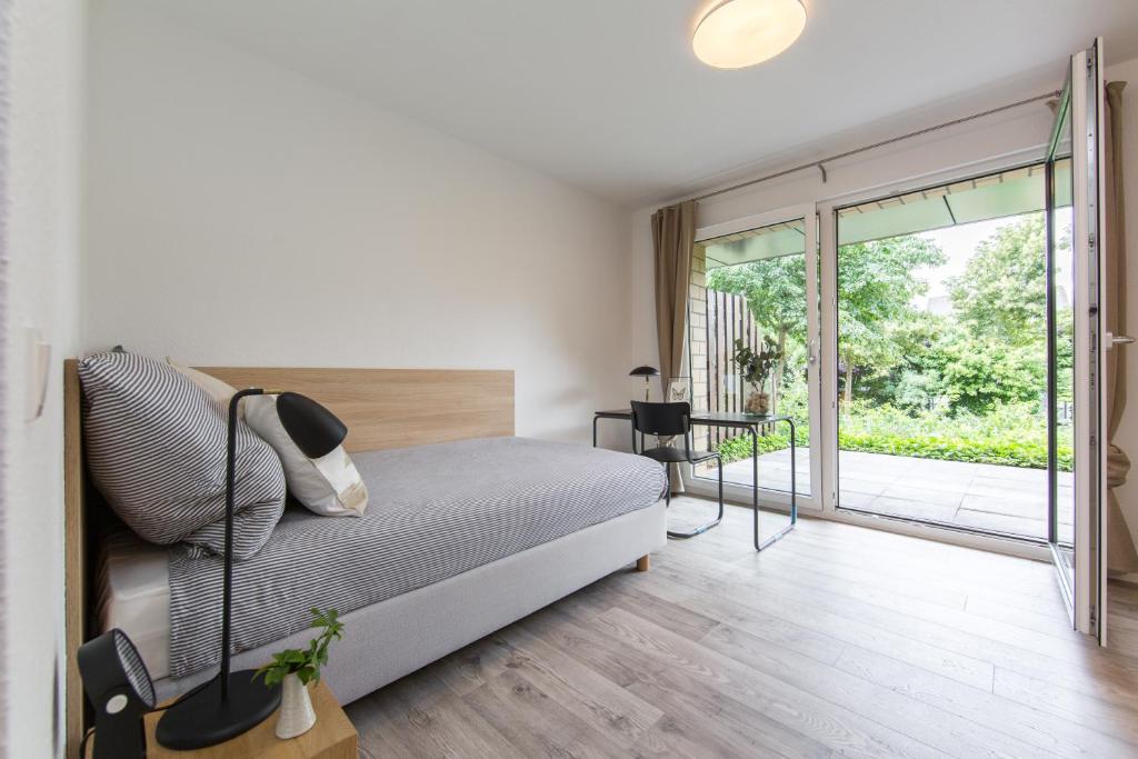 Llit o llits en una habitació de Home & Coliving Bremen