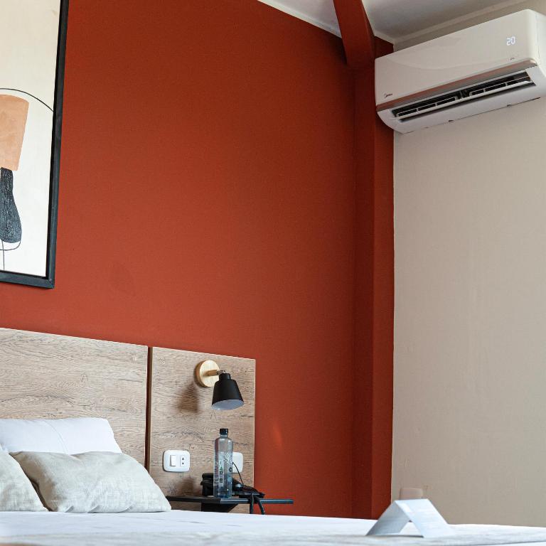 Postel nebo postele na pokoji v ubytování Rua Hoteles Talara