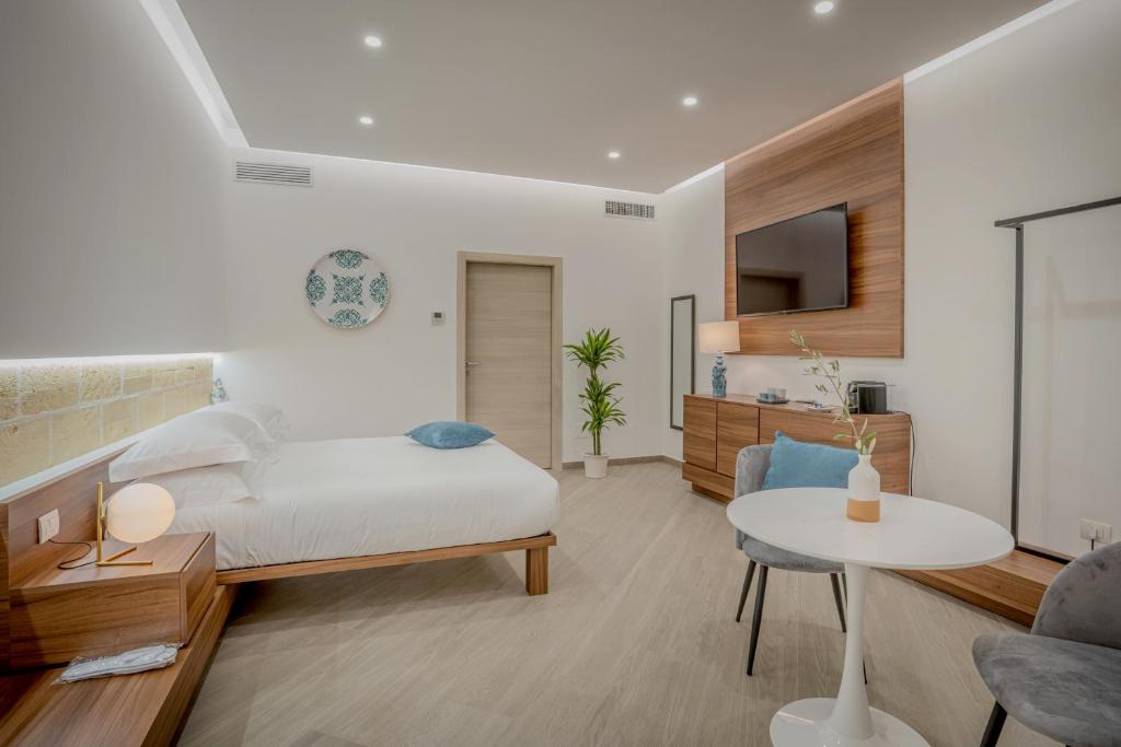 Postel nebo postele na pokoji v ubytování Tufo Bianco Relais