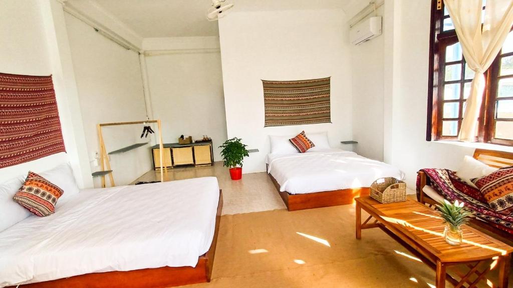 Giường trong phòng chung tại Maidi Homestay Mui Ne