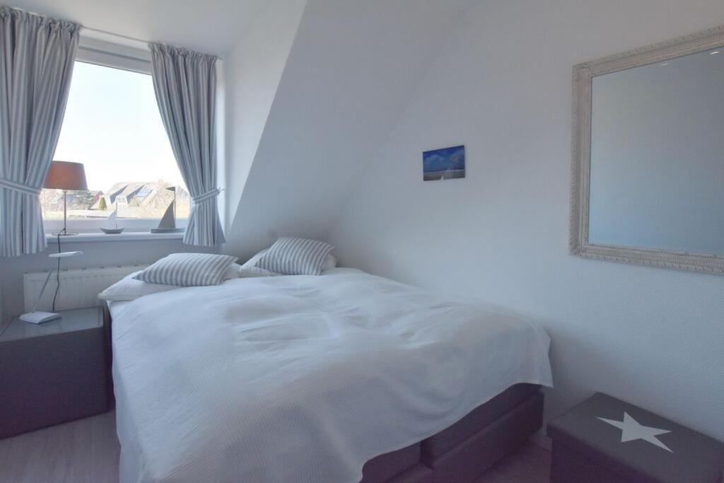 Postel nebo postele na pokoji v ubytování Westhüs 13