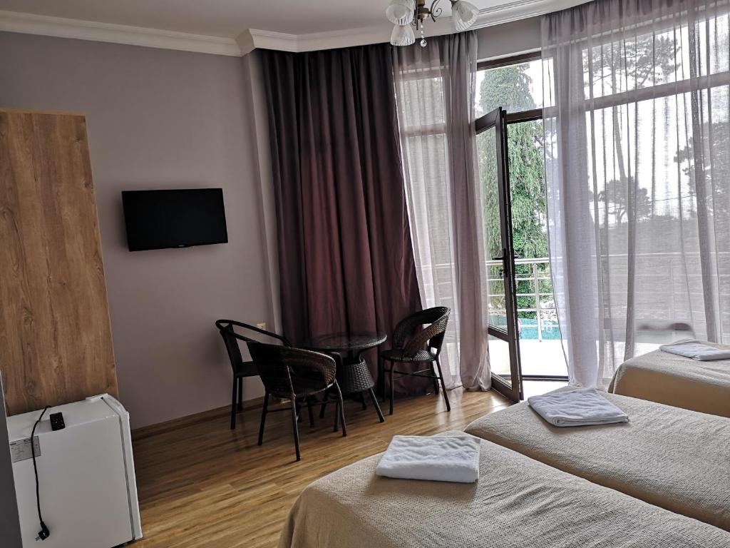 Postel nebo postele na pokoji v ubytování FRESH Hotel Kobuleti