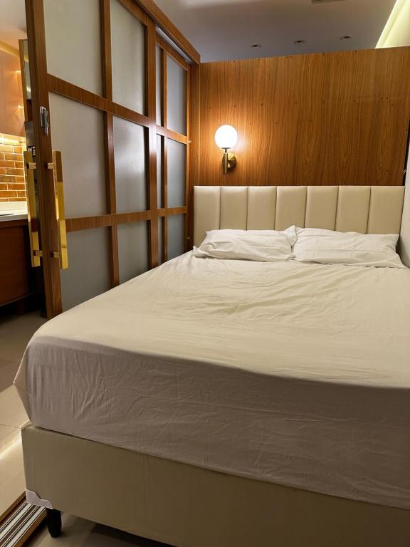 Ένα ή περισσότερα κρεβάτια σε δωμάτιο στο Flat luxo Gravatá