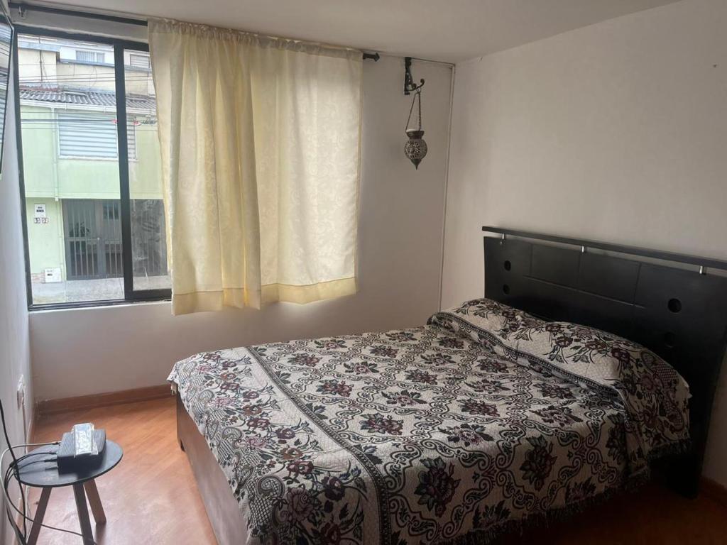 Un pat sau paturi într-o cameră la Bhospedaje