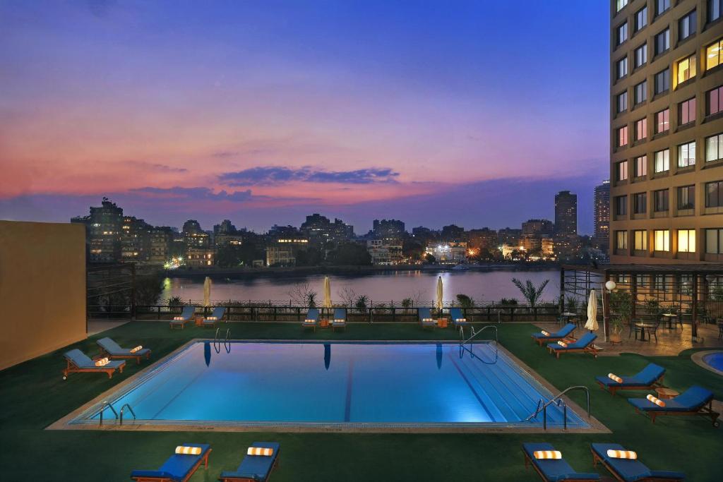 a swimming pool on the roof of a building at Cairo World Trade Center Hotel & Residences in Cairo