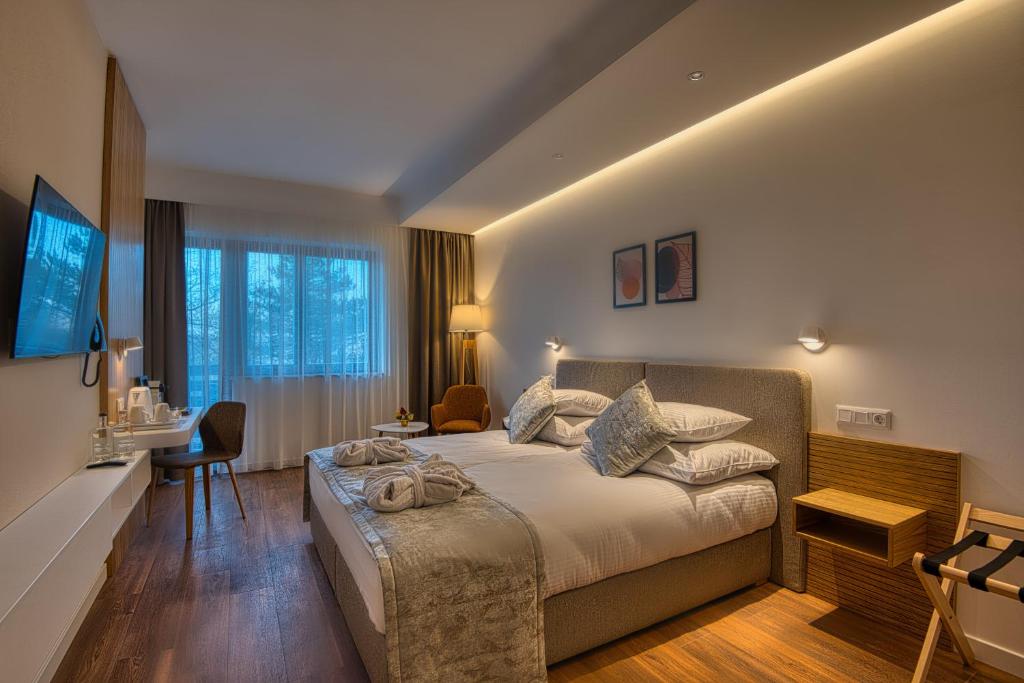 Postel nebo postele na pokoji v ubytování Cardoner Hotel és Konferenciaközpont