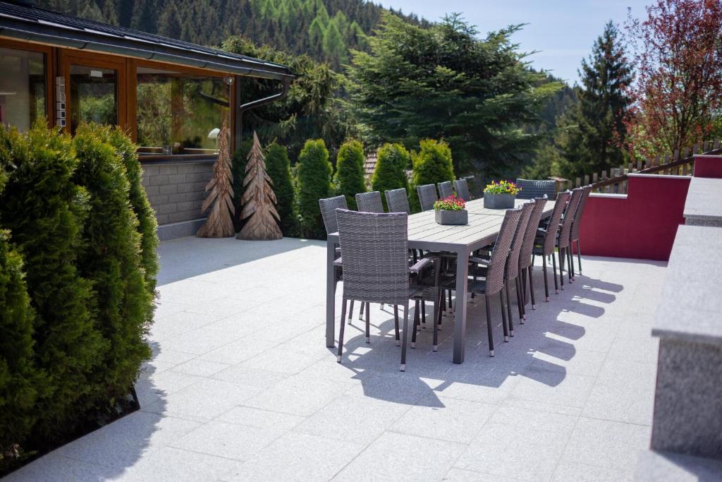 a table and chairs sitting on a patio at Ferienhaus 'am Berg' in Fehrenbach