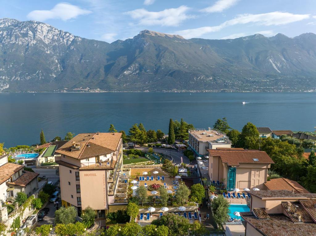 an aerial view of a town next to a body of water at Hotel Garda Bellevue in Limone sul Garda