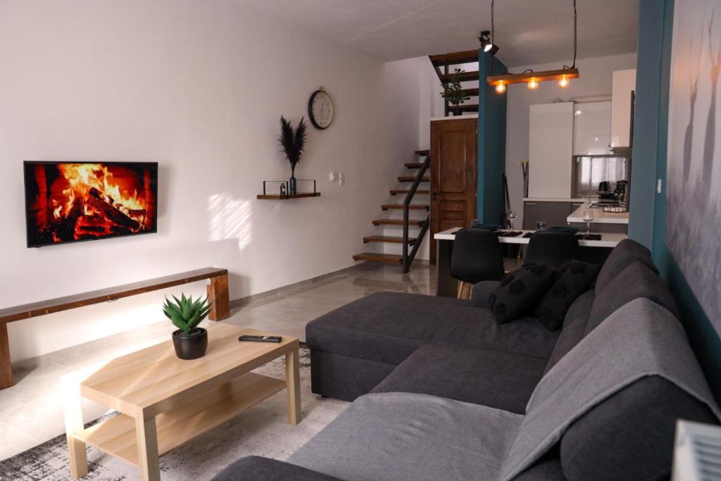 a living room with a couch and a table at NINA'S HOUSE in Tríkala