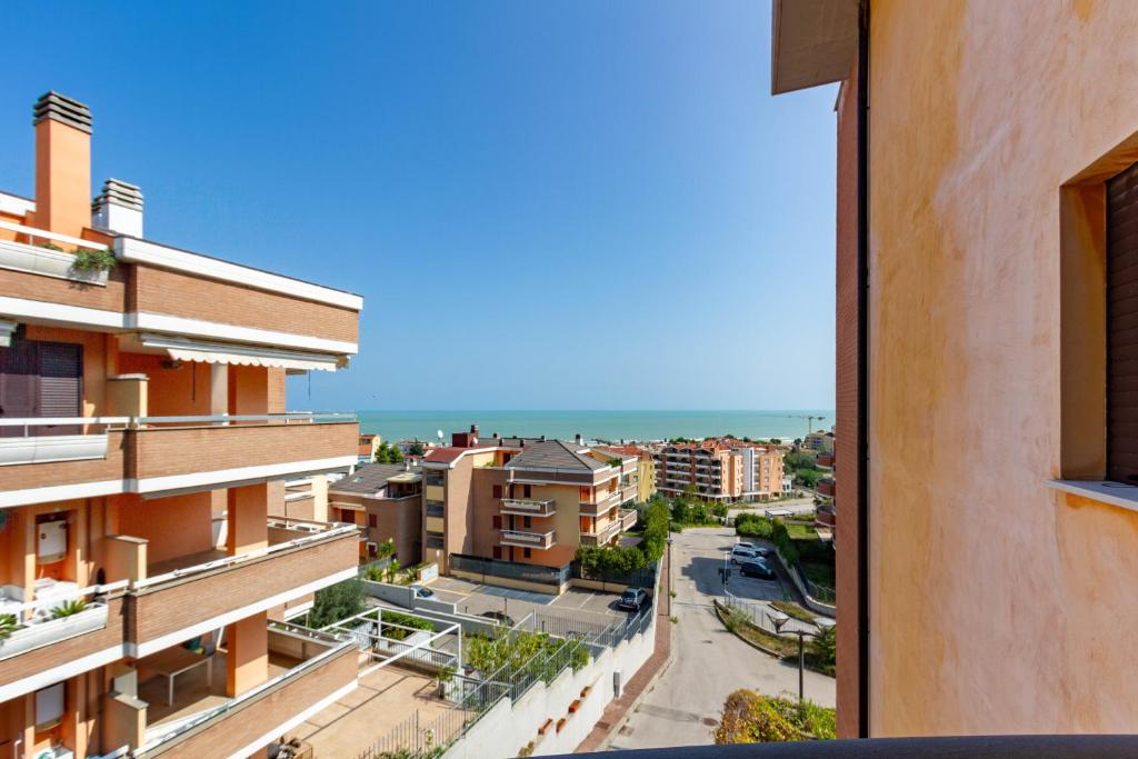a view of the ocean from a building at Appartamento Sandra Trilo - MyHo Casa in Vasto