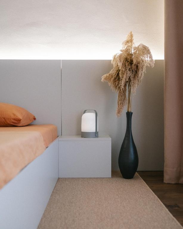 Postel nebo postele na pokoji v ubytování ETERN Apart Hotel