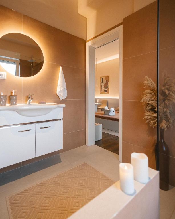 Koupelna v ubytování ETERN Apart Hotel