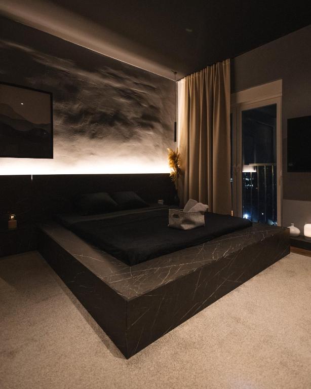 Postel nebo postele na pokoji v ubytování ETERN Apart Hotel