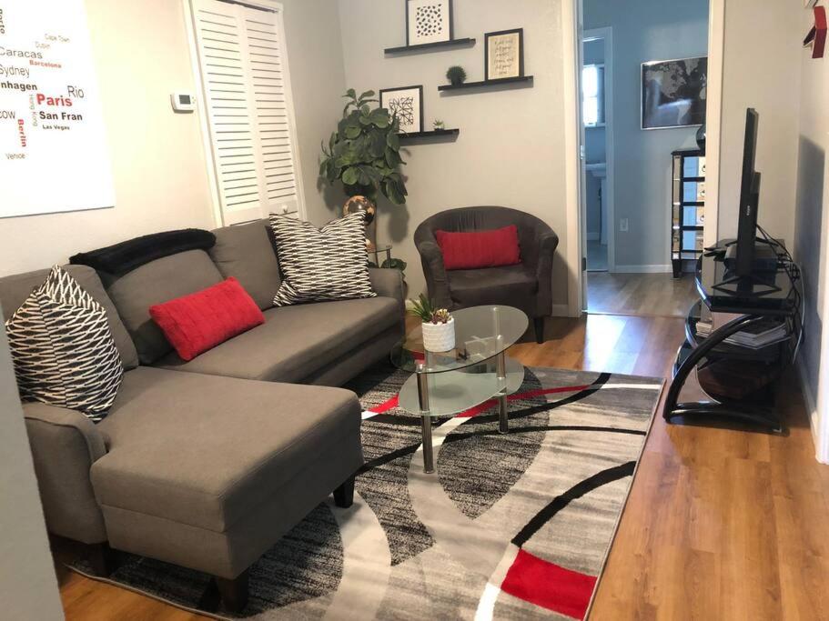 a living room with a couch and a table at Downtown Dunedin! 2 bedroom 2 bath NO PETS in Dunedin