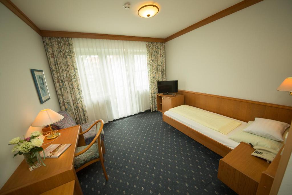 Postel nebo postele na pokoji v ubytování Garni Hotel Danja Herold e. U.