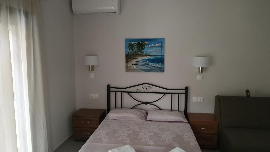 Postel nebo postele na pokoji v ubytování House Evristhenis 2