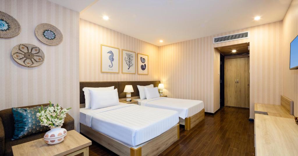 Postel nebo postele na pokoji v ubytování DB Hotel Nha Trang