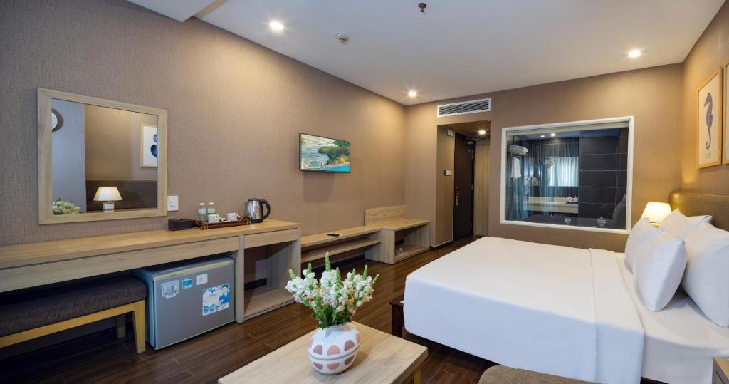 Postel nebo postele na pokoji v ubytování DB Hotel Nha Trang