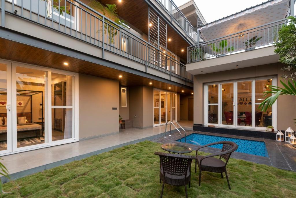 an image of a house with a swimming pool at The Deck in Jaipur