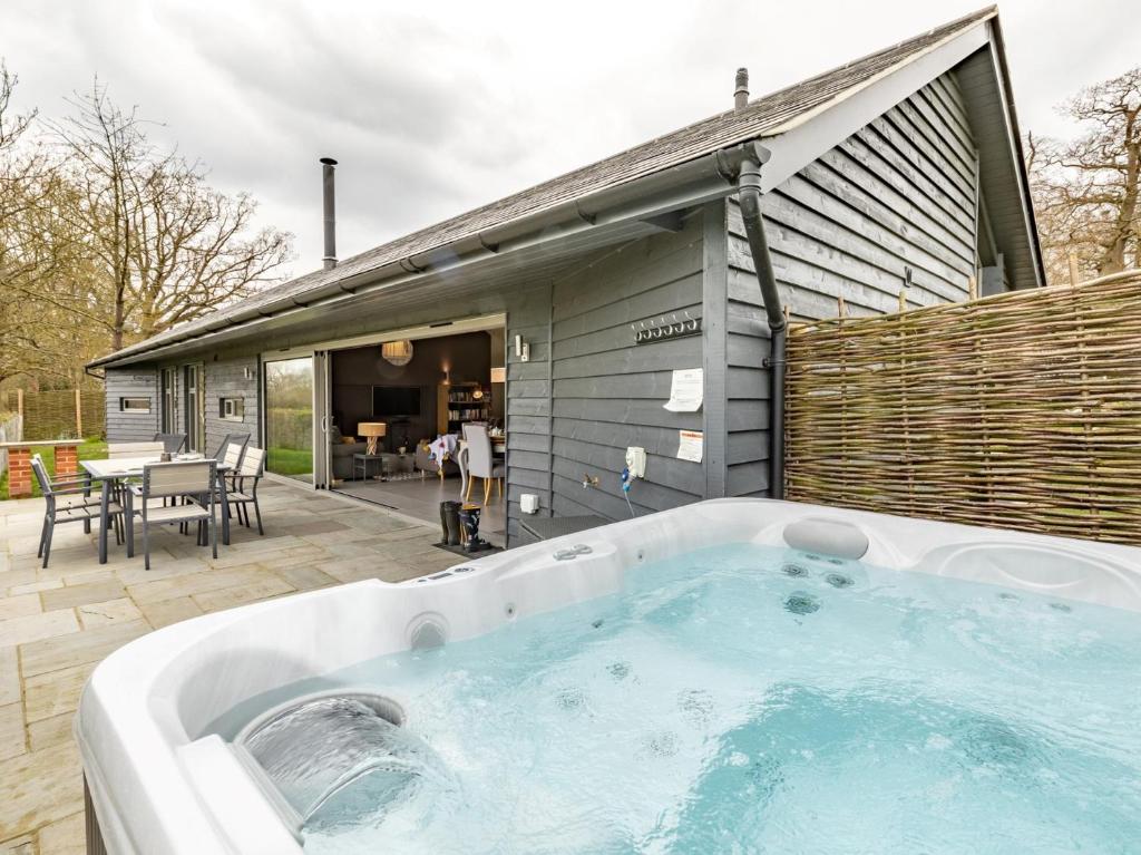 a hot tub in front of a house at 2 Bed in Eye 51468 in Wortham