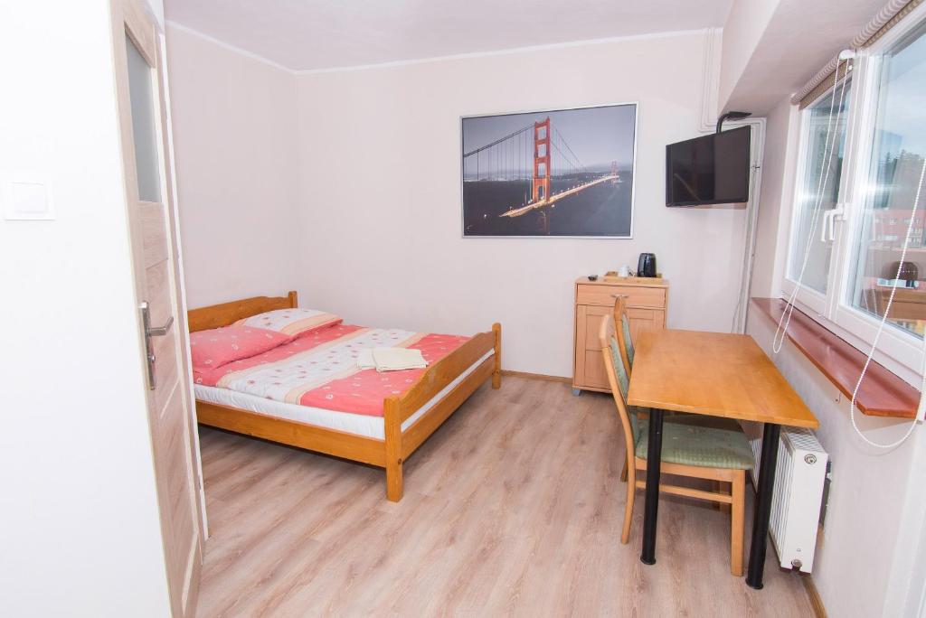 Postel nebo postele na pokoji v ubytování Willa Nova - Centrum