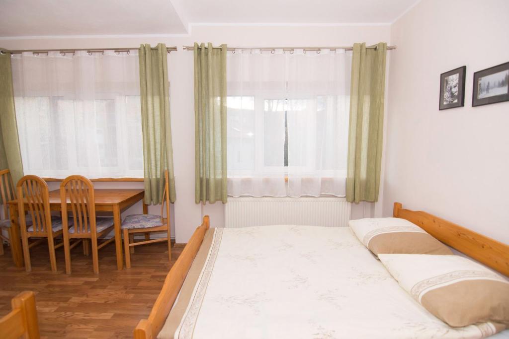Postel nebo postele na pokoji v ubytování Willa Nova - Centrum