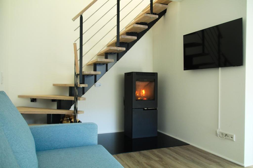 Μια τηλεόραση ή/και κέντρο ψυχαγωγίας στο Ferienhaus mit Alpenpanorama