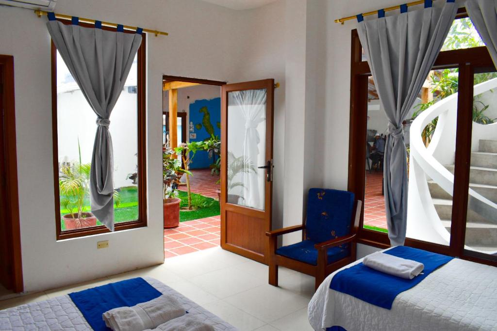 Postel nebo postele na pokoji v ubytování Gran Hostal Tintorera