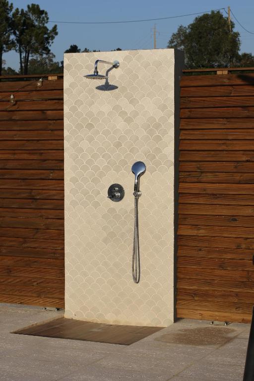 a wall with a picture of a toothbrush on it at Zambujal Suites in Sesimbra