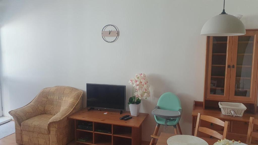 A television and/or entertainment centre at KF Apartment Donovaly