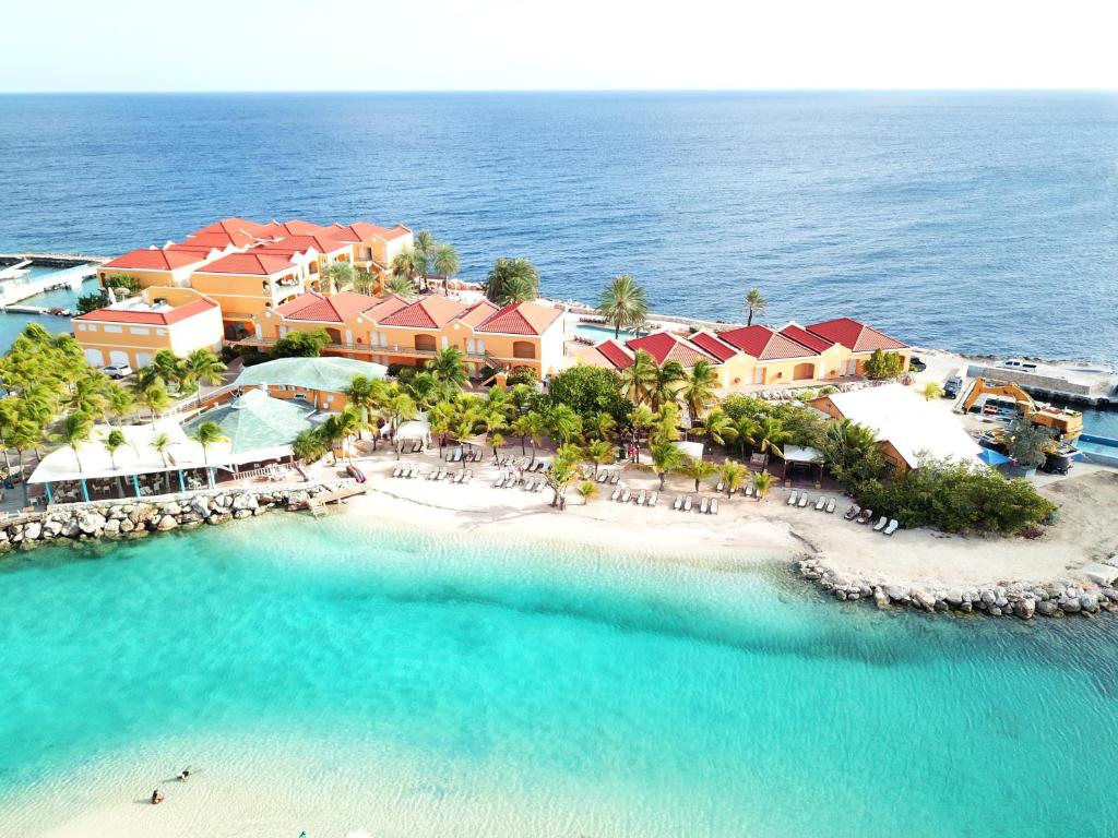 an aerial view of a resort in the ocean at The Royal Sea Aquarium Resort in Willemstad