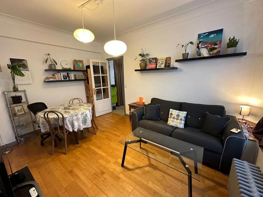 a living room with a couch and a table at Next to Paris Metro - Calm & Convenient Apartment in Villejuif