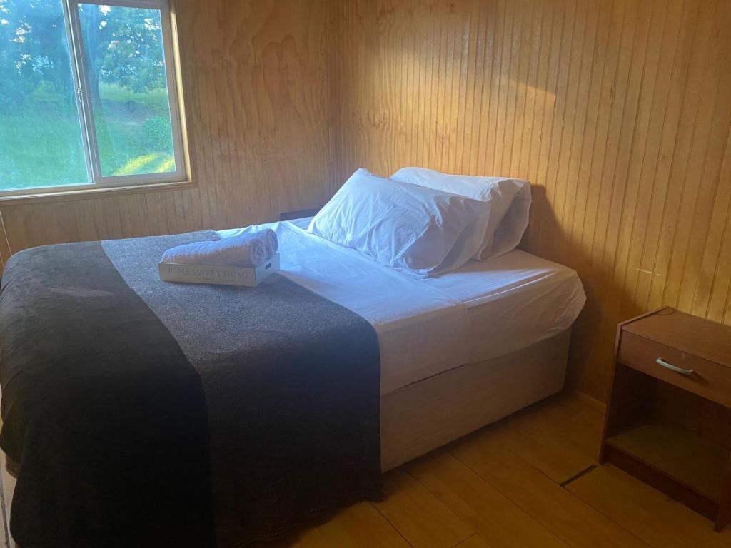 Ένα ή περισσότερα κρεβάτια σε δωμάτιο στο Hermosa Cabaña Duplex en Villa Alto de Puerto Varas