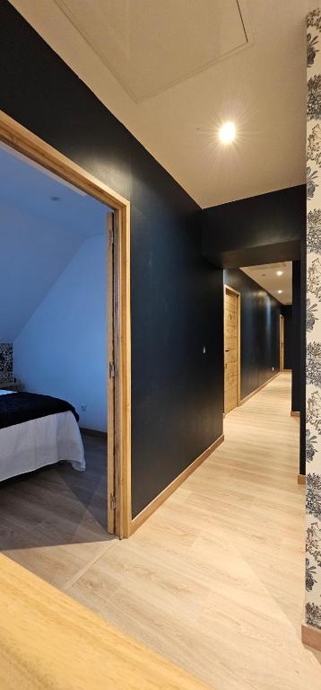 a bedroom with a bed and a large glass door at Le Clos Maldier - Gîte de la Belle vue in Laon