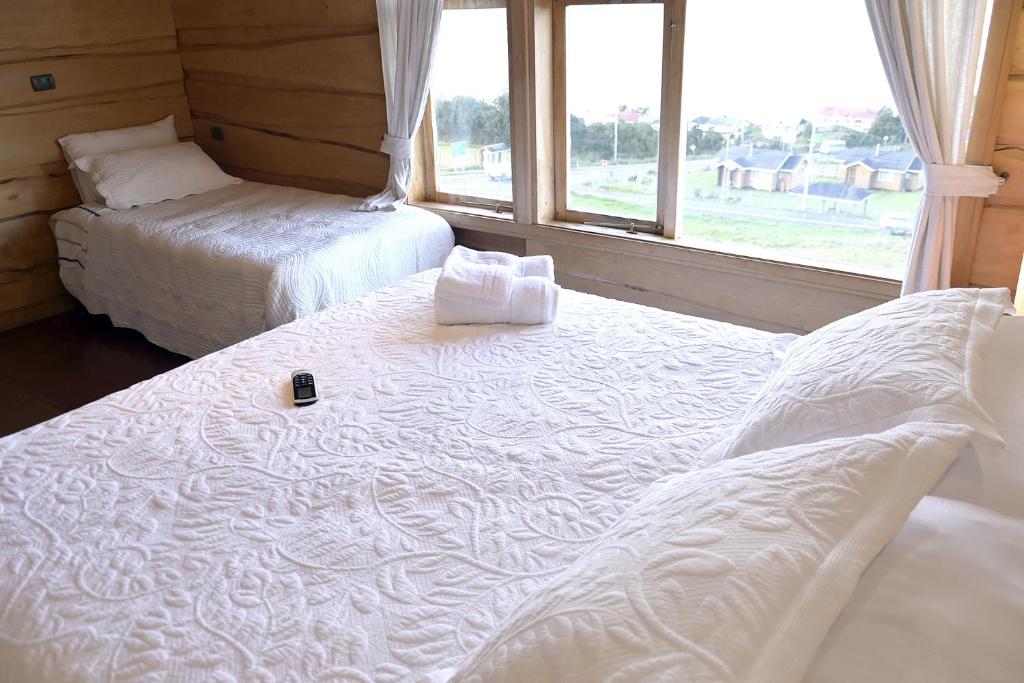 Postel nebo postele na pokoji v ubytování Hotel Boutique Antukenu