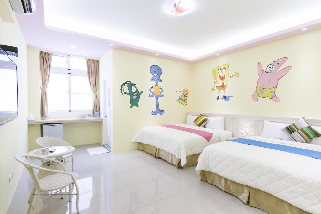 Postel nebo postele na pokoji v ubytování Mu Yu B&B