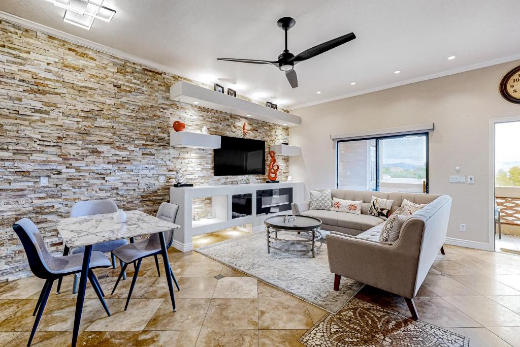 a living room with a brick wall at Desert Cottage in Fountain Hills
