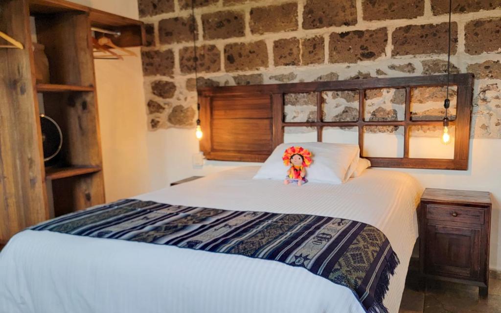 Säng eller sängar i ett rum på Casona Hotel Petra