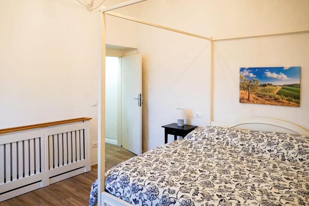 a bedroom with a bed with a canopy at RossoToscano 
