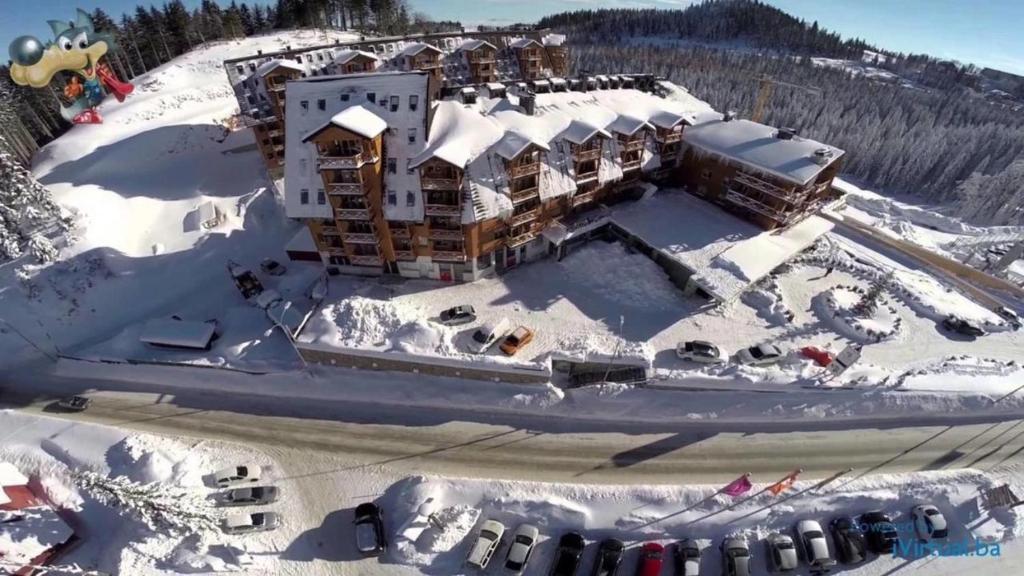 an aerial view of a resort in the snow at Apartment B326 - Aparthotel Vučko in Jahorina