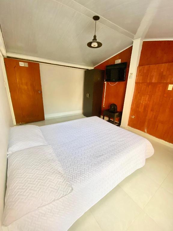 Postel nebo postele na pokoji v ubytování HOTEL CUMANDAY