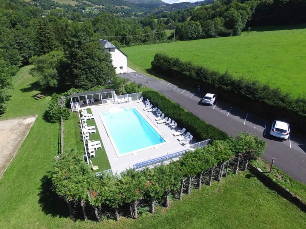 an aerial view of a house with a swimming pool at La Grange du Devezou in Saint-Jacques-des-Blats