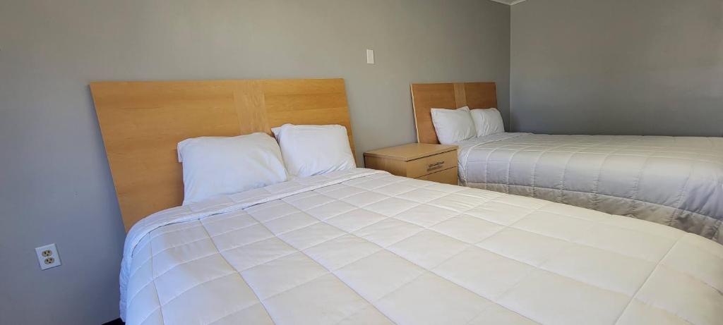 Postel nebo postele na pokoji v ubytování Superlodge