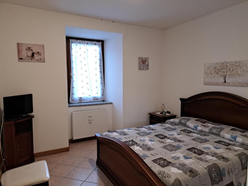 Postel nebo postele na pokoji v ubytování Appartamento panoramico a due passi dal Tonale